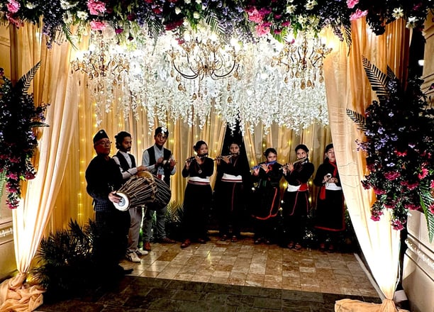 Newari folk instrumentalists performing live in a reception gate for a wedding