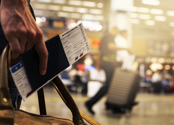 a person with boarding pass in an airport