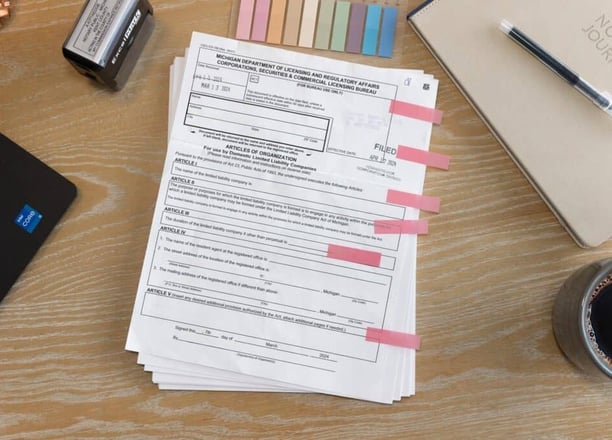 a stack of documents for a commercial real estate closing ready to be notarized