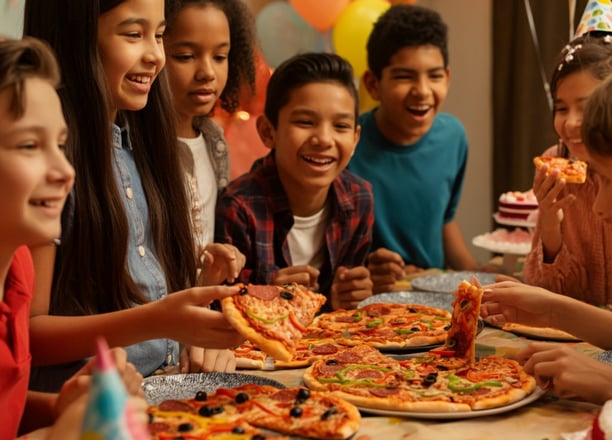 Kids eating pizza at a party