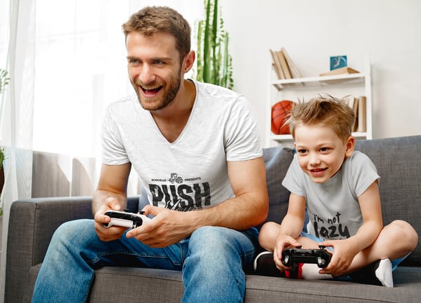 a man and a boy playing video games