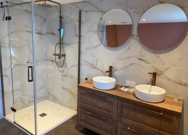 a bathroom with a shower and a sink