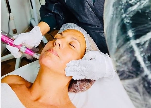 a woman getting a facial lift in a beauty salon