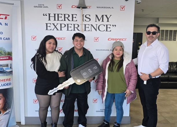 a group of people standing in front of a sign