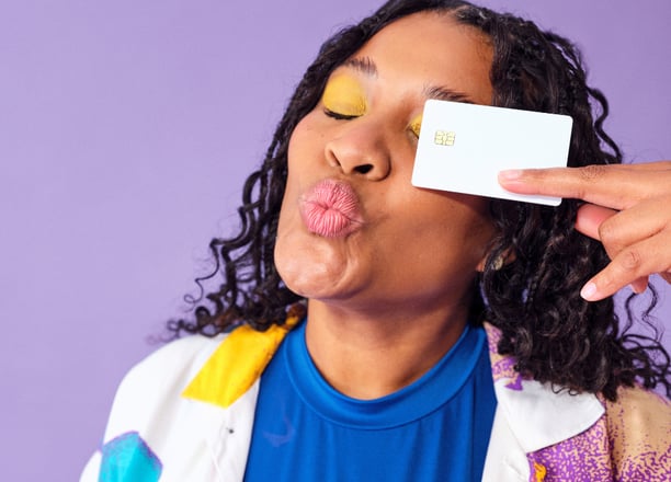 College student holding campus credit card for cashback and no annual fee