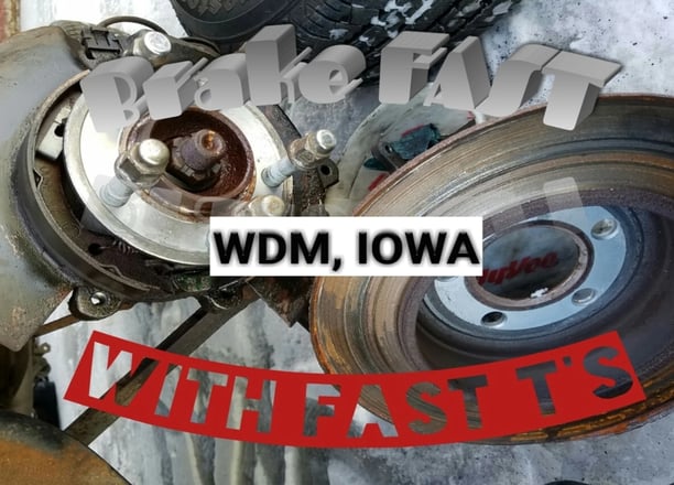 Worn out brake rotors that Fast T's Brake Service removed leaning together 