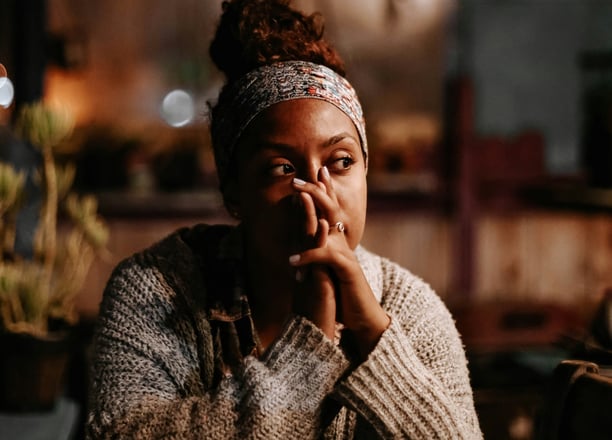 a woman with a headband and a headband on her hands