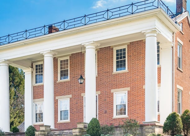 a large brick building with columns and columns