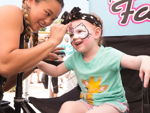 Caroline Face Painting a Hello Kitty at a Park in Las Vegas