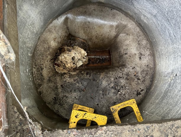 A septic tank being blocked by tissues.