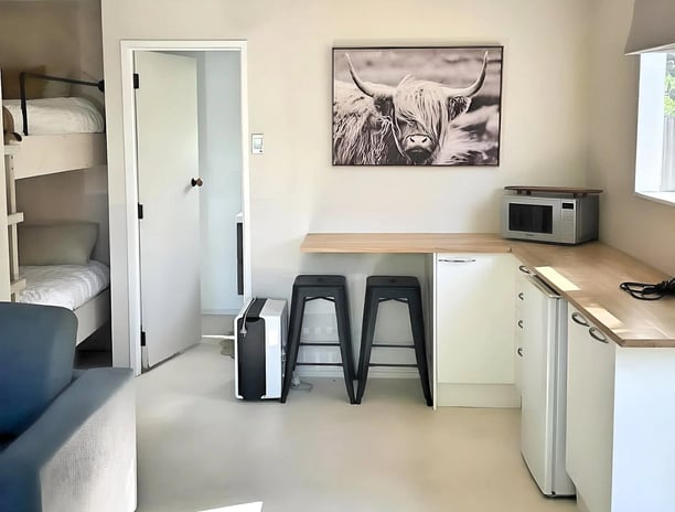 Room with bunks and kitchenette