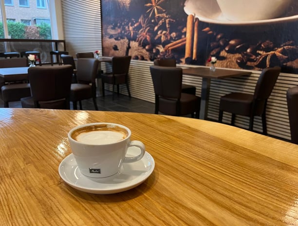 a cup of coffee on a table in a restaurant