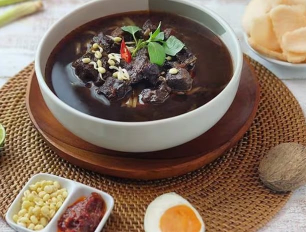 a bowl of soup with a bowl of soup and a bowl of chips