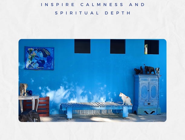a blue wall with a white cat sitting on a blue wall