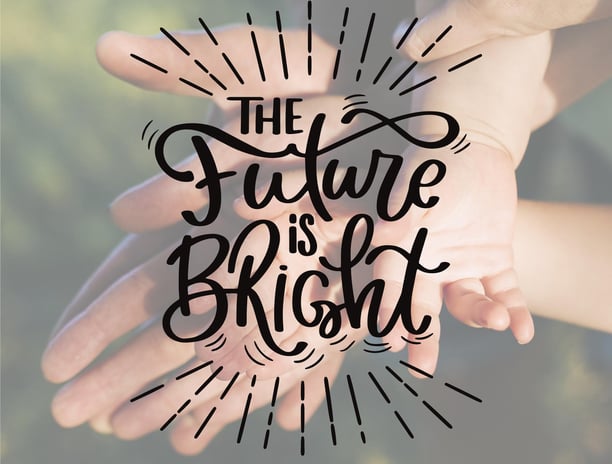 a person holding a hand with the words, the future is bright and bright