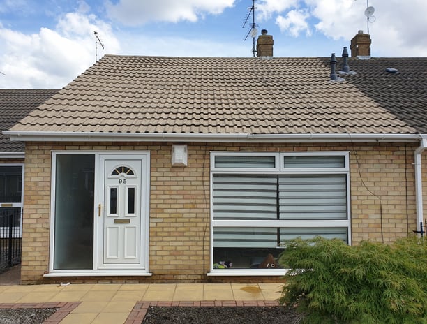 After photo of a bungalow roof in Hull, professionally jetwashed to remove moss and grime, revealing clean roof tiles