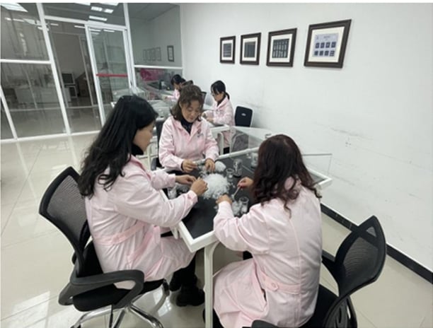 a group of people in lab duct feather