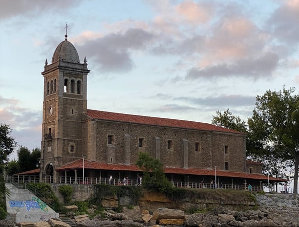 a large building with a clock tower in the middle of it
