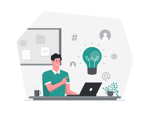 a man sitting at a desk with a laptop and a light bulb