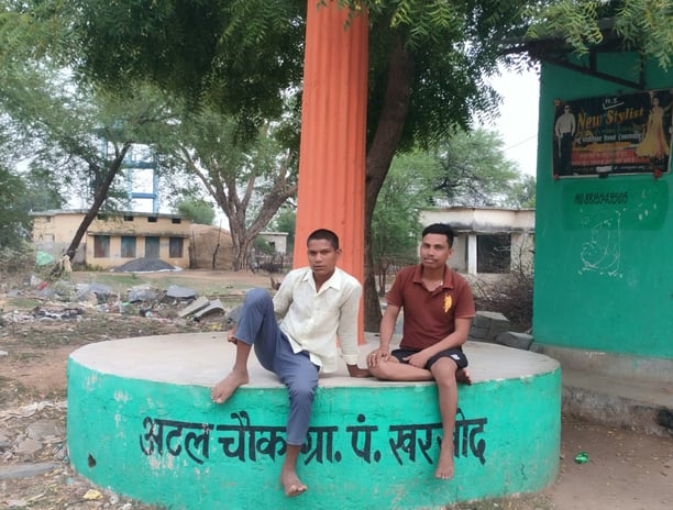 Two people sit on the atal chowk