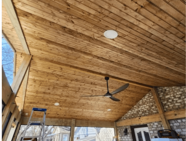 a ceiling fan with a ceiling wood, framing