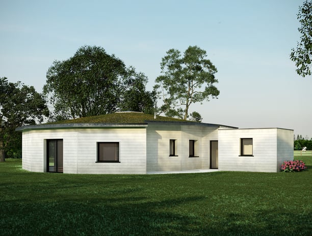 a small white house with a green roof