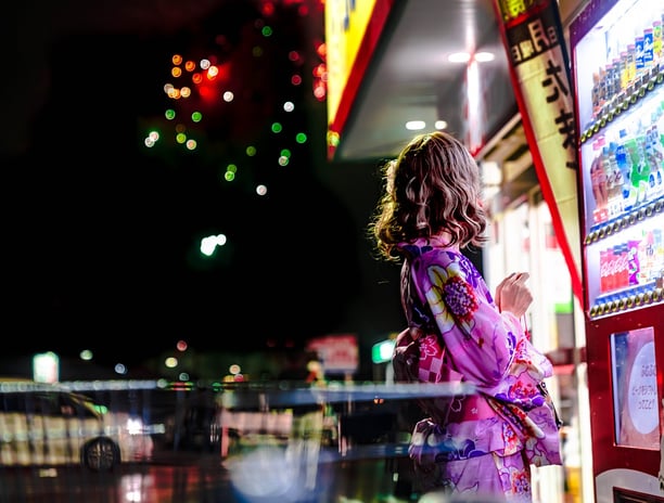 A girl shopping from vending machine