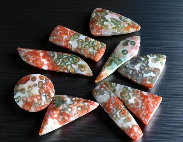 red ocean jasper cabochons rare collectors material with red and green orbs