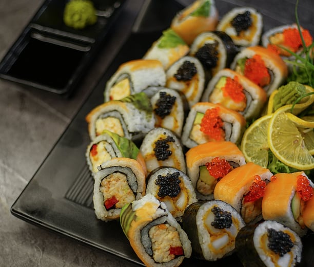 A plate full of different sushi