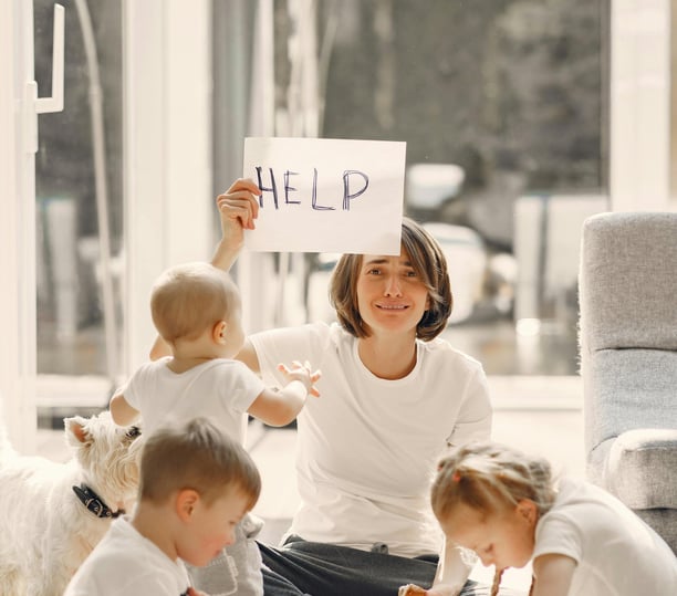 a woman holding a sign that says help