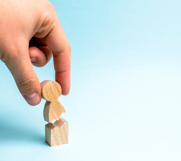 Personal Injury (broken wooden figure of a person being put back together)