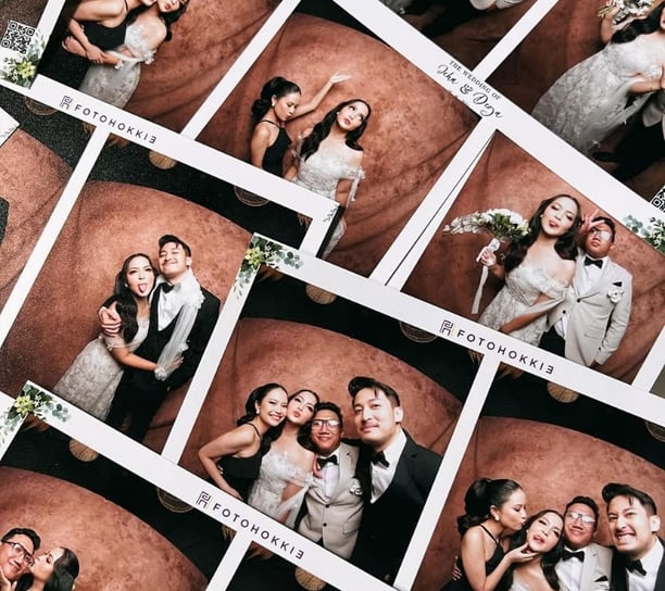 a couple of people posing for a photo booth
