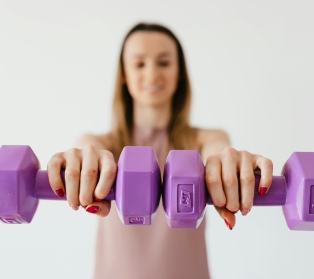 female adult lifting weights for exercise