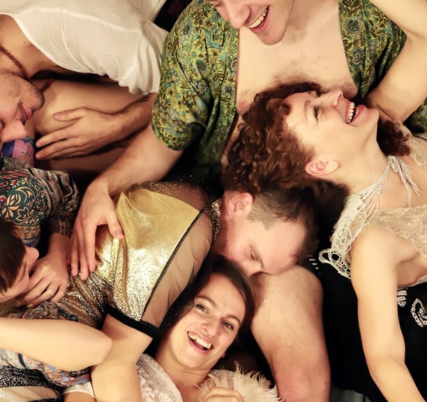 a group of people being in a cuddle puddle
