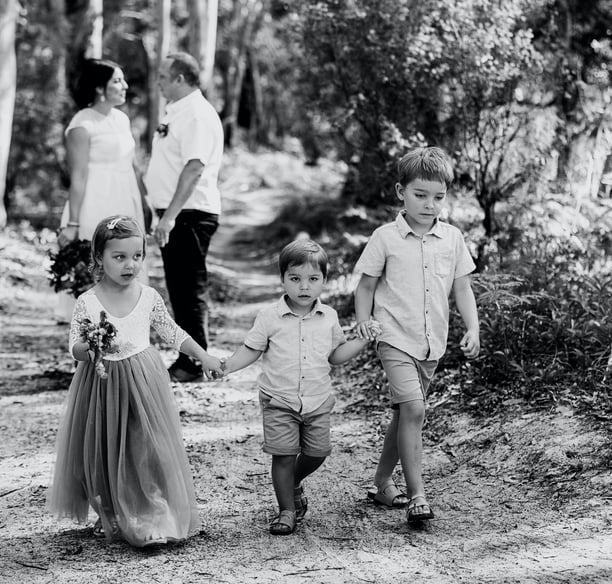 Children participating in a joyful Noosa Sunshine Coast Briabane wedding ceremony Noosa beach