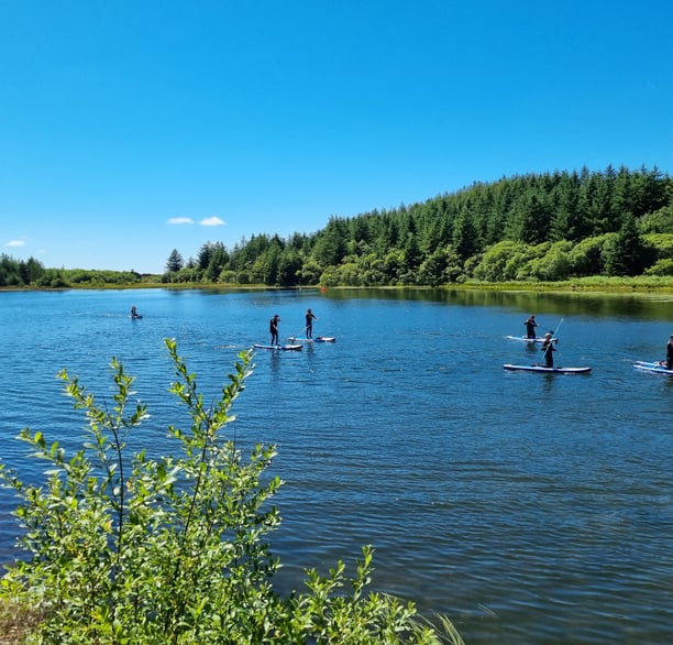 Paddle board lesson at Llyn Pendam