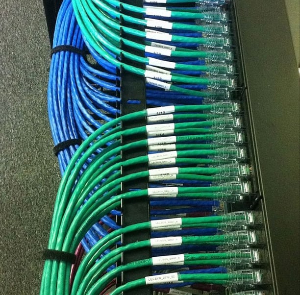 a rack of cables and cables connected to a server