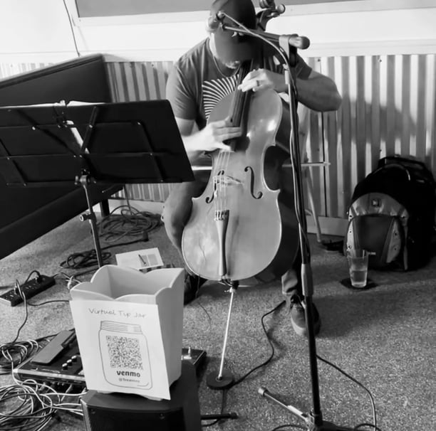 Treavor Eaton Music performing his cello at a restaruant