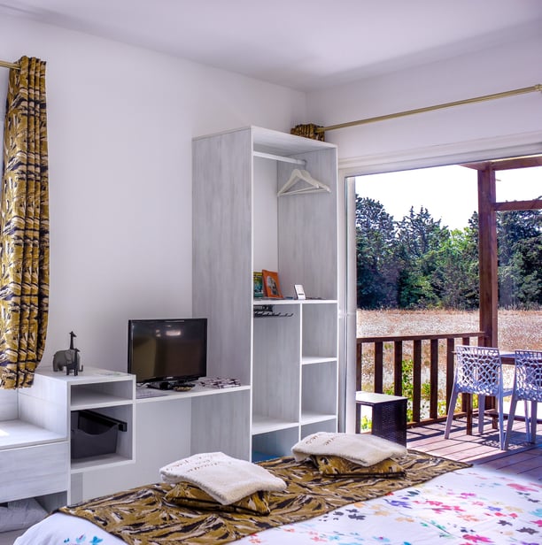Bed with full bedding, floating bed with swimming pool view, olive grove view and garden at Domaine Des Lucques