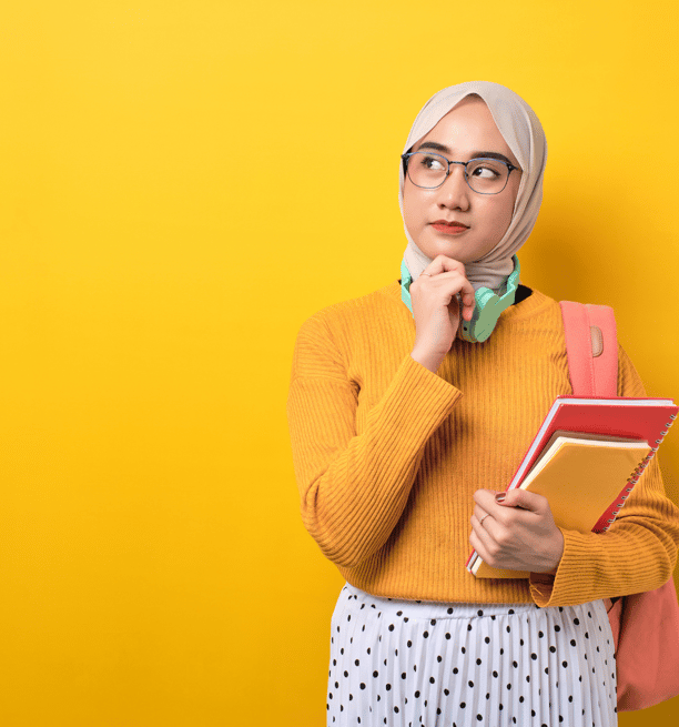 a muslim girl looks thoughtfully off to the side. she's standing on a yellow background.