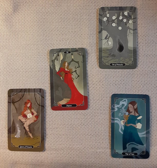4 tarot cards in a spread 10 pentacles, Empress, Queen Pentacles Page Cups