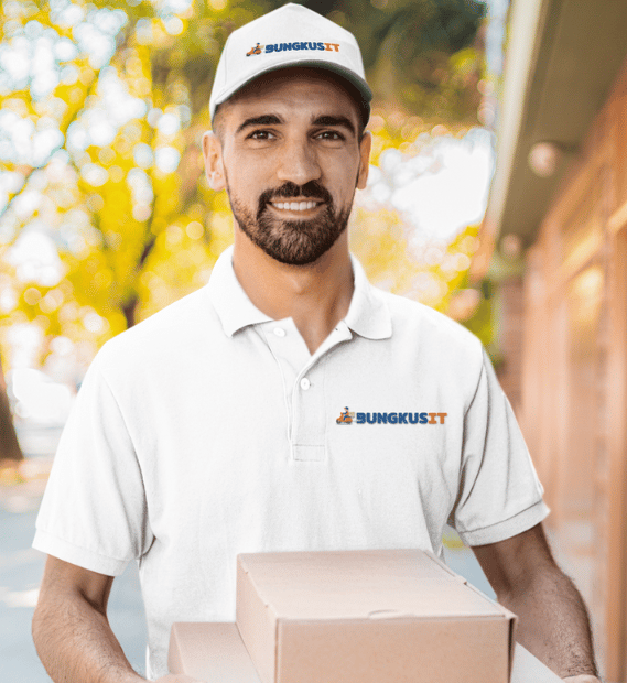 a man in a white shirt is holding a box of pizza