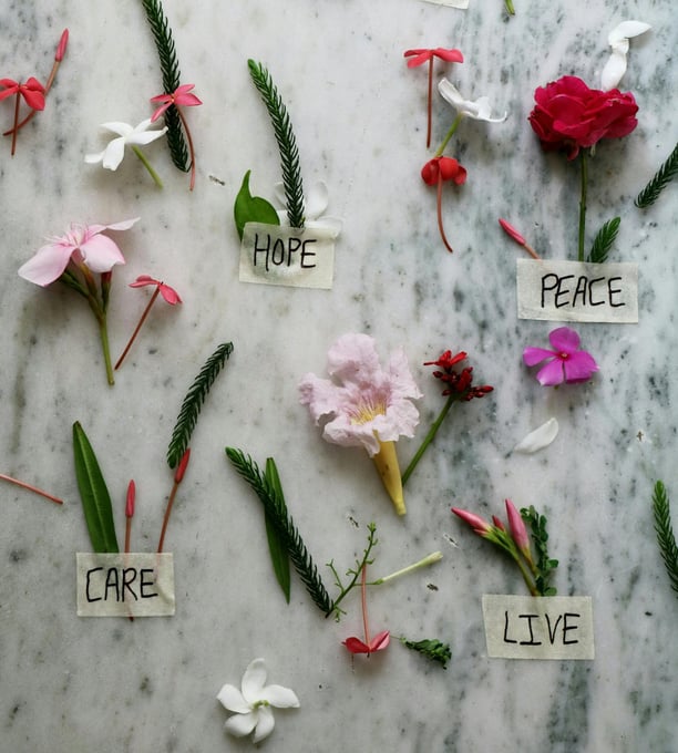 a table with flowers and words on it