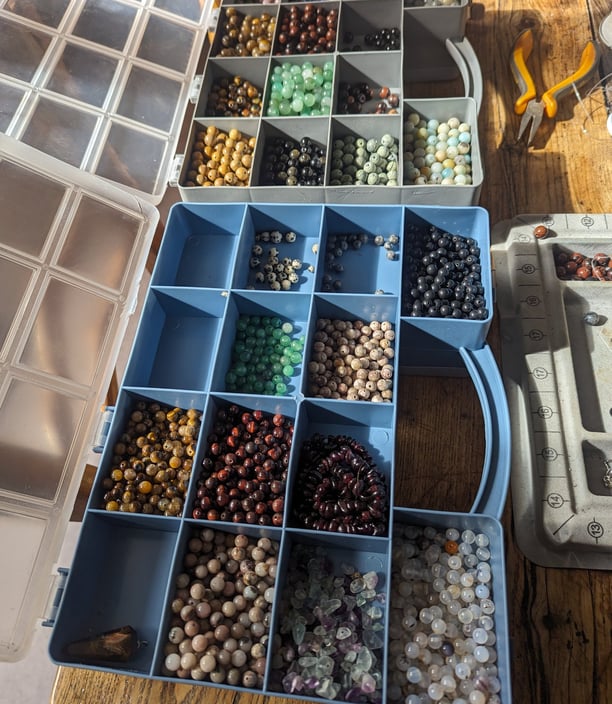 a bunch of beads and beads on a table