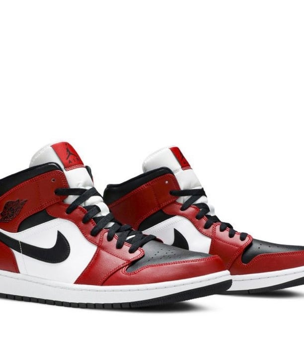 Air Jordan 1 Mid 'Chicago Black Toe' sneakers in black, white, and red with high-top design and Nike Swoosh