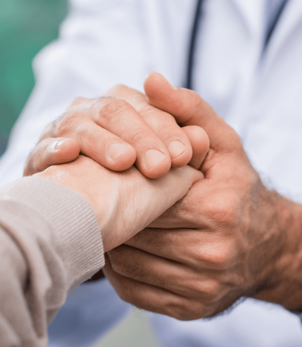 a doctor shaking hands with a patient