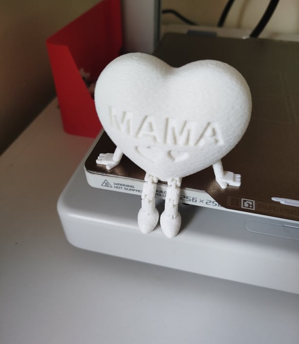 a 3D printed heart with articulated feet