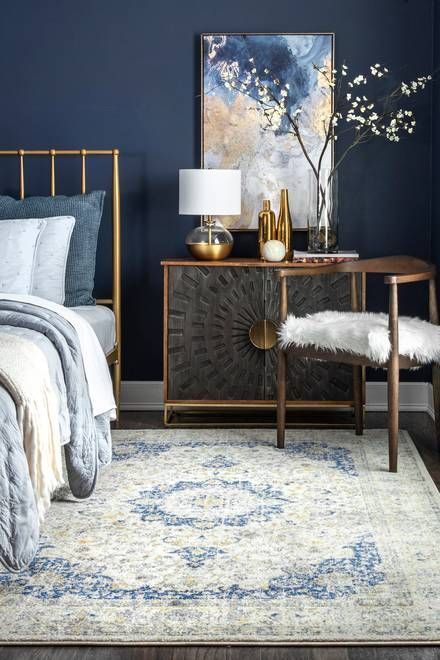 blue paint, blue rug and blue comforter with gold bed frame