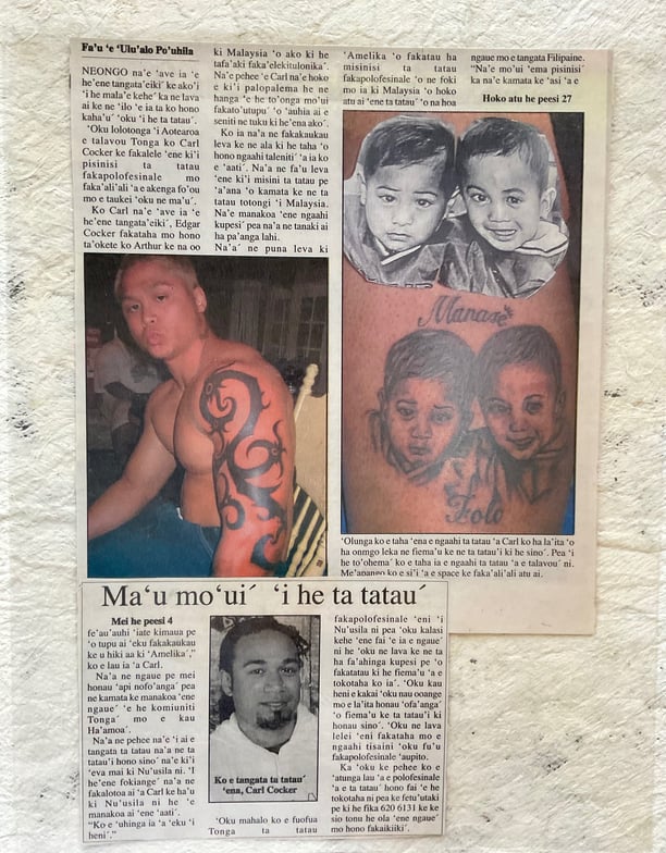 Carl Cocker on newspaper, Borneo tattoo, 2003