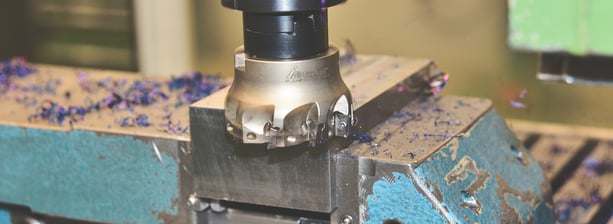 a machine is making a hole in the center of a machine